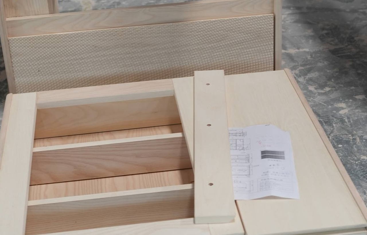 Bathroom vanity production samples, finish boards, technical drawings, and packaging