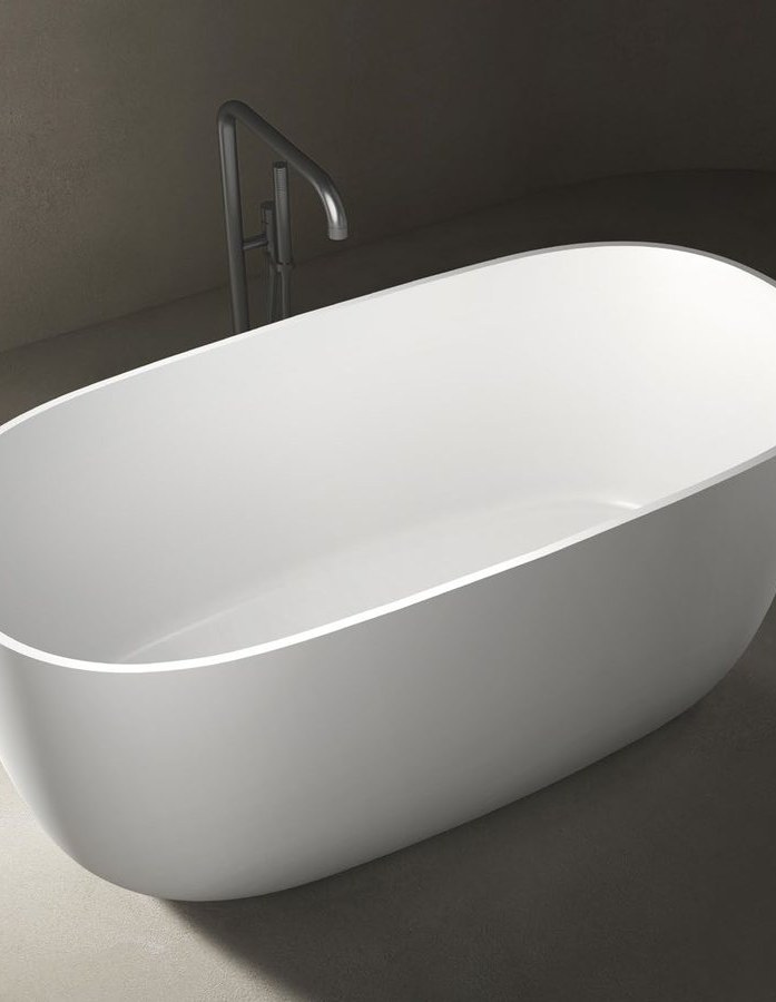 A compact freestanding soaking bathtub