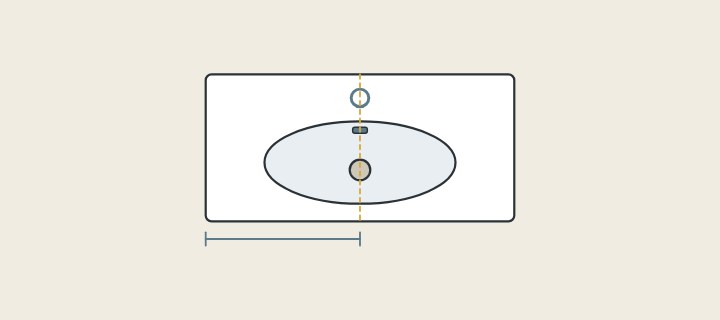 Illustration of a vanity top seen from above with a basin, a faucet hole, a drain hole and an overflow, and a dimension line