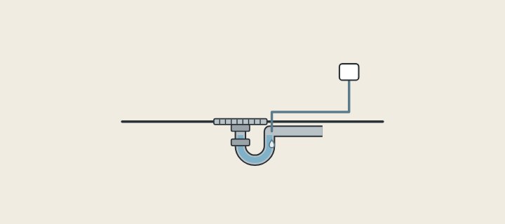 Illustration: a floor drain with a water trap below it and a small supply line dripping water into the trap