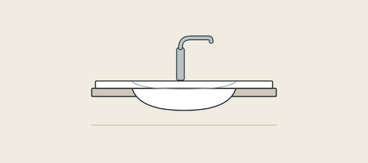 Illustration: a long vanity top with a basin formed into it and a faucet behind