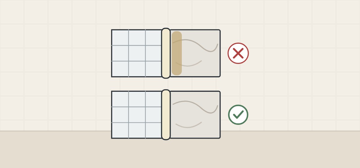 Illustration of two tile-to-stone joints, one with the stone stained along the bead and a cross, one with clean stone and a tick