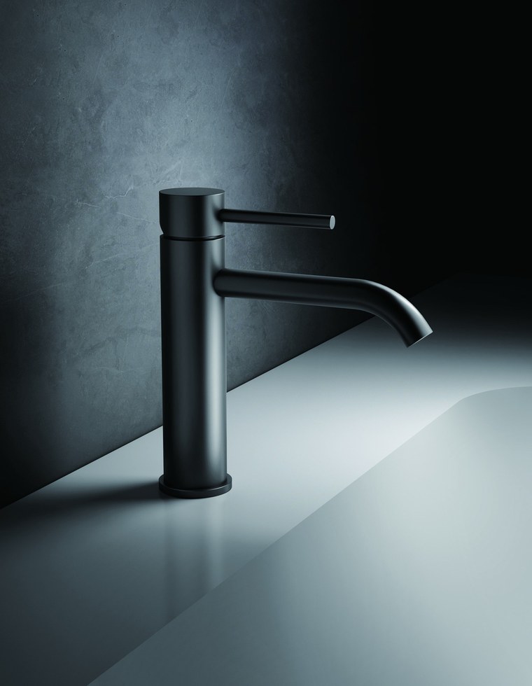 A black single-hole basin faucet on a white basin