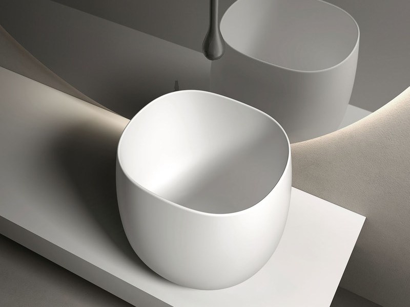 A vessel basin shown with its faucet and waste