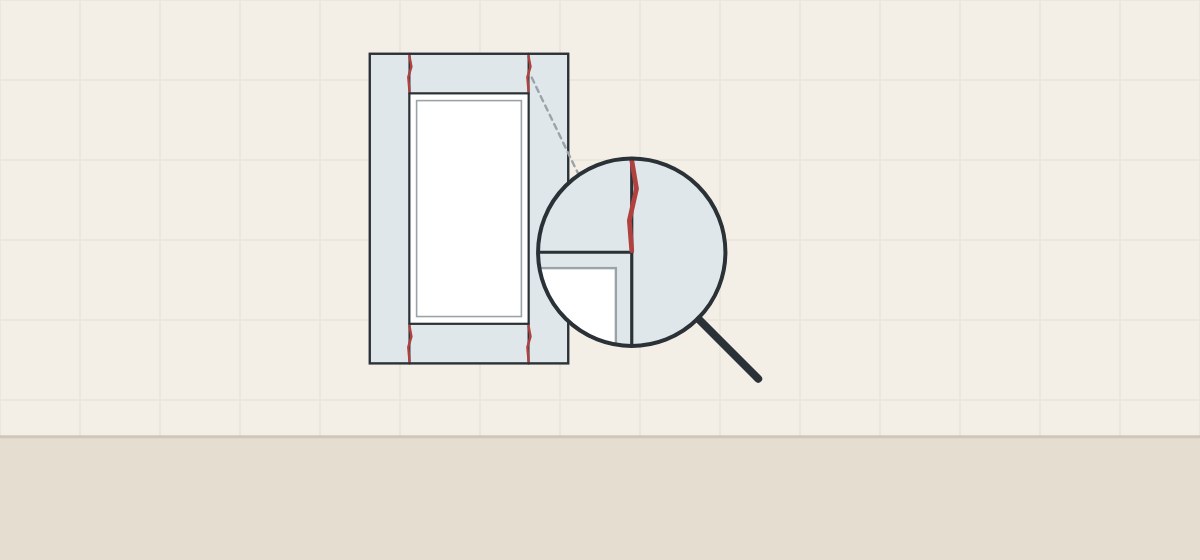 Illustration of a painted frame-and-panel door with thin lines at its frame joints and a magnifier enlarging one joint