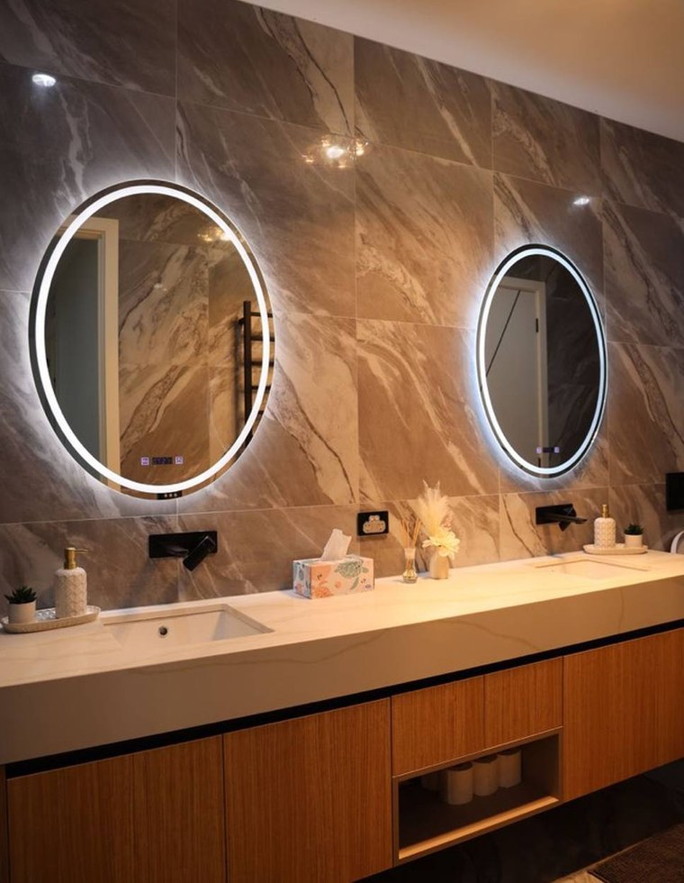 A wall-mounted bathroom vanity in a finished bathroom