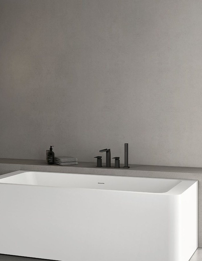 A solid surface bathtub shown with its specification drawing