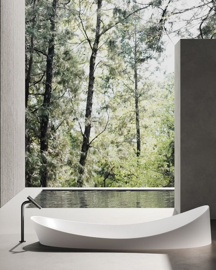 A freestanding solid surface bathtub in a spa setting