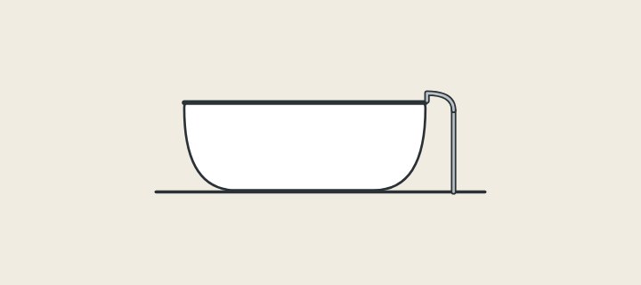 Illustration of a freestanding bathtub on a floor beside a floor-mounted filler