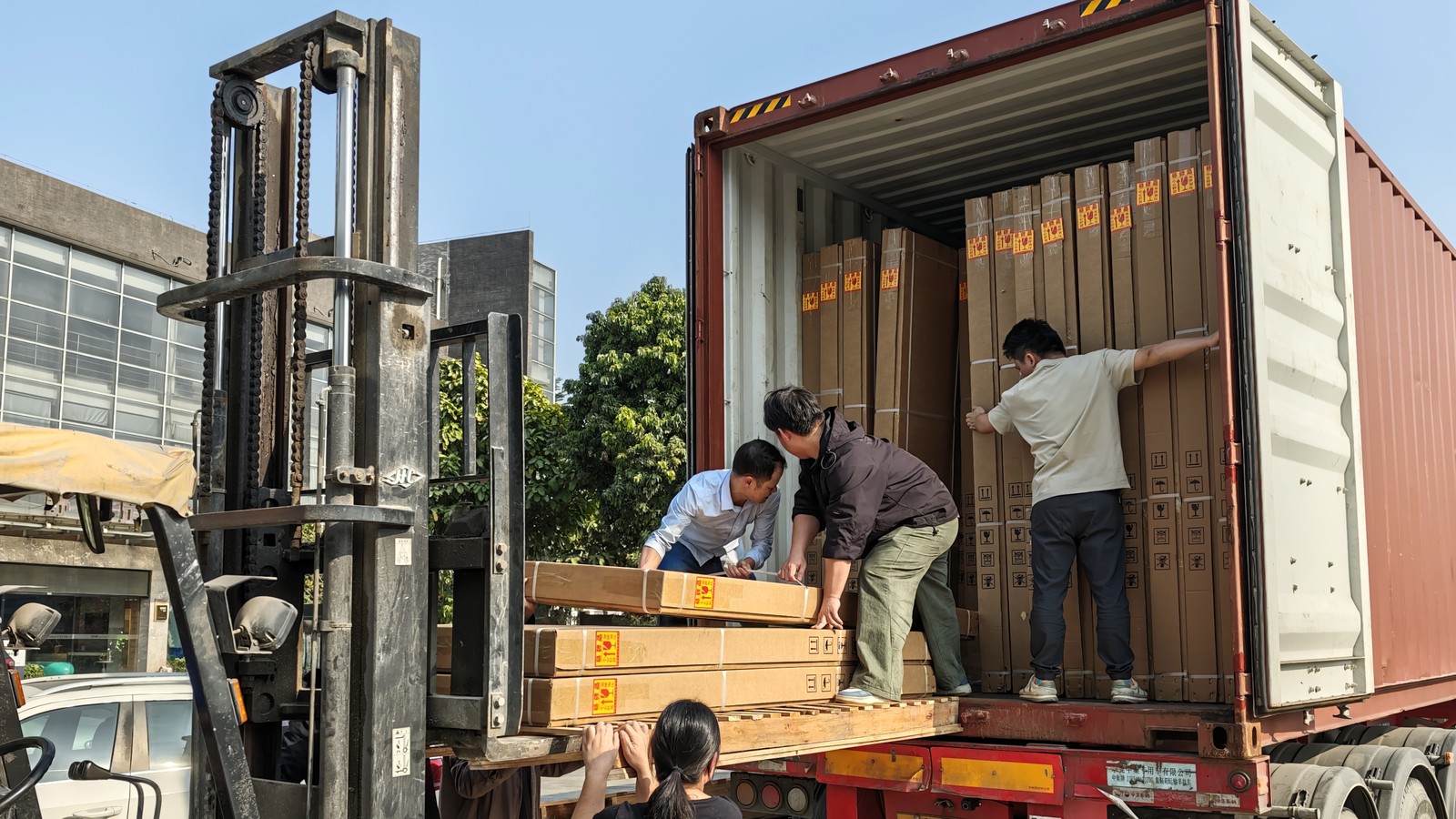 Cartons being loaded into a container, stacked to use the space efficiently