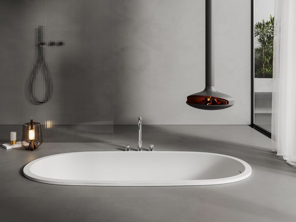 An oval built-in solid surface bathtub