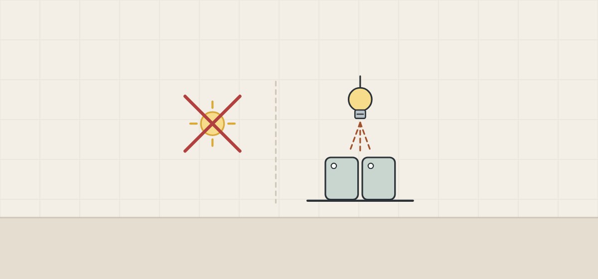 Illustration of a sample and its reference compared under an indoor lamp, with direct sunlight crossed out