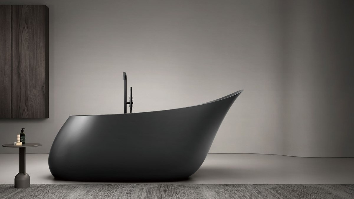 A compact soaking bathtub in an apartment bathroom