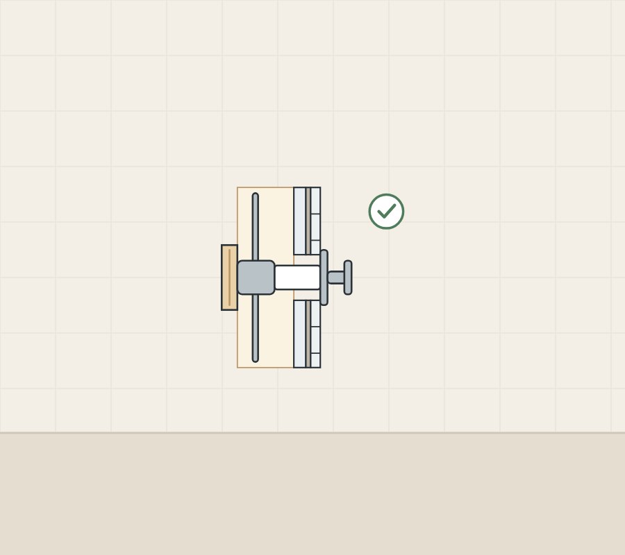 Illustration of a wall section with the trim fitted on the tile face, with a tick