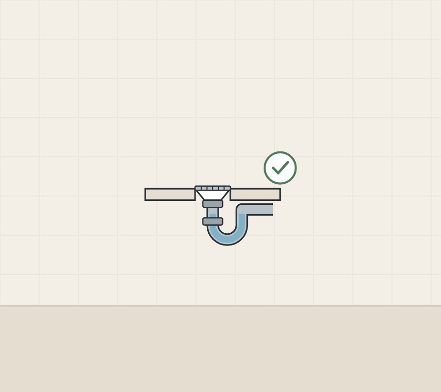 Illustration of a floor drain in section with a full water trap and a tick