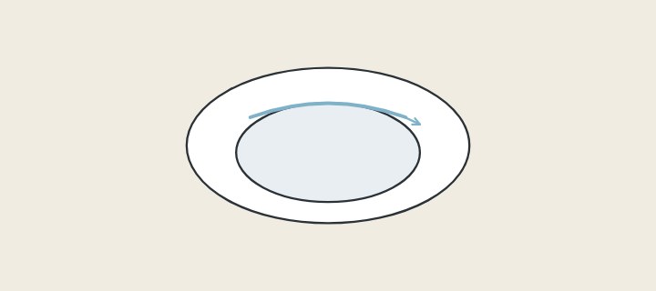 Illustration: a toilet bowl from above with a water jet running around the inner rim