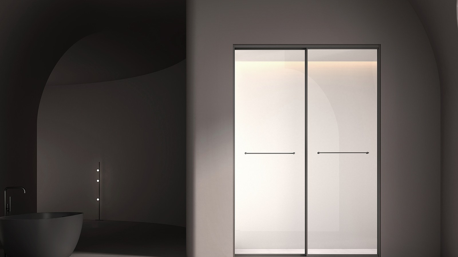 A frameless shower enclosure in a hospitality bathroom