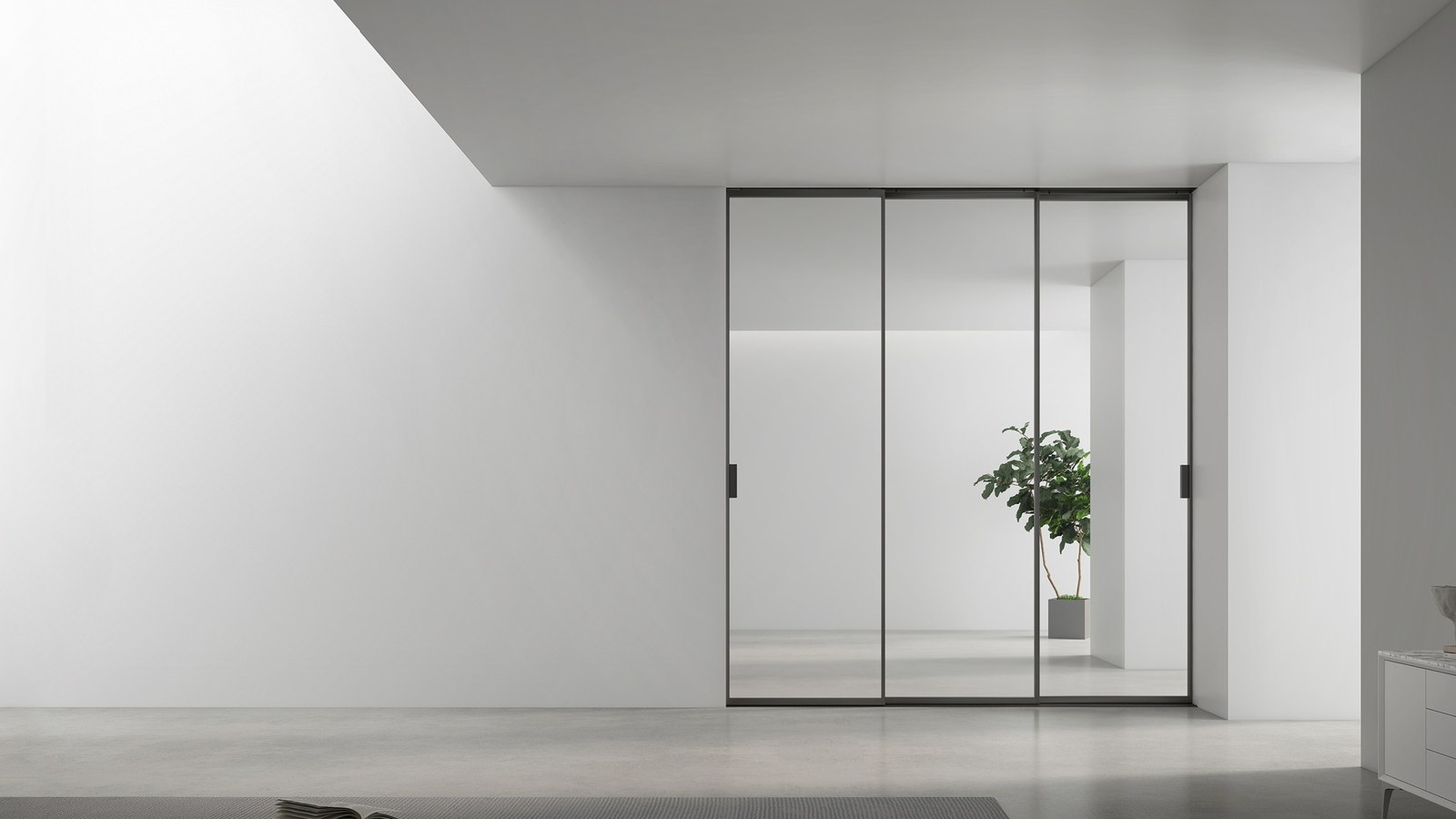 A frameless shower enclosure fitted against a tiled wall