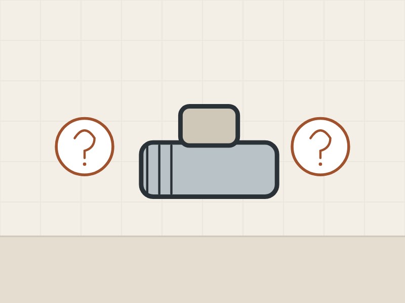 Illustration of a vacuum-breaker fitting between two question marks