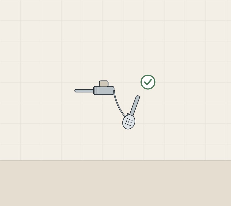 Illustration of a supply pipe, vacuum-breaker fitting and hose to a hand shower, with a tick