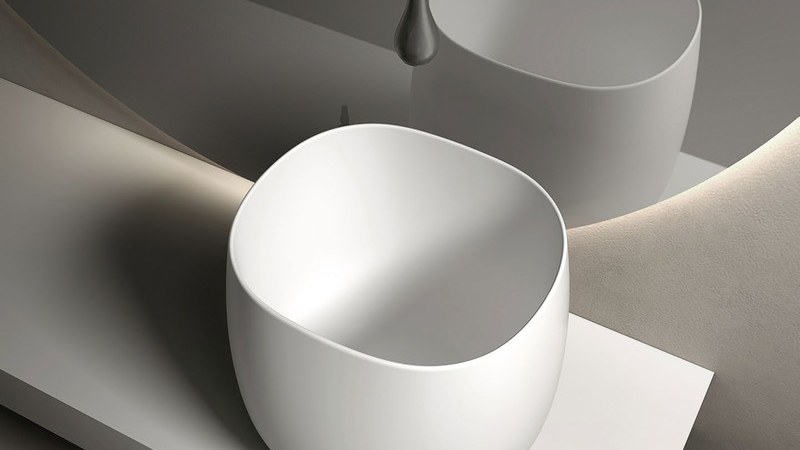 A vessel basin shown with its faucet and waste