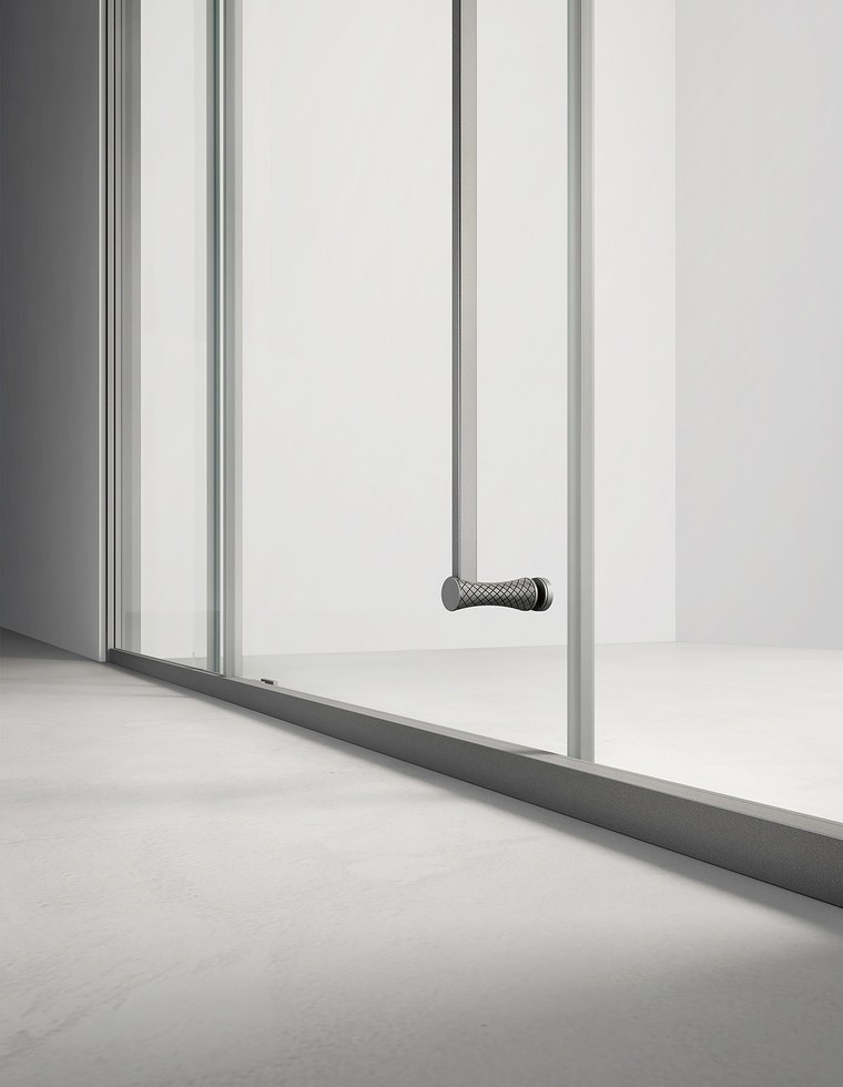 A polished glass edge on a frameless shower panel