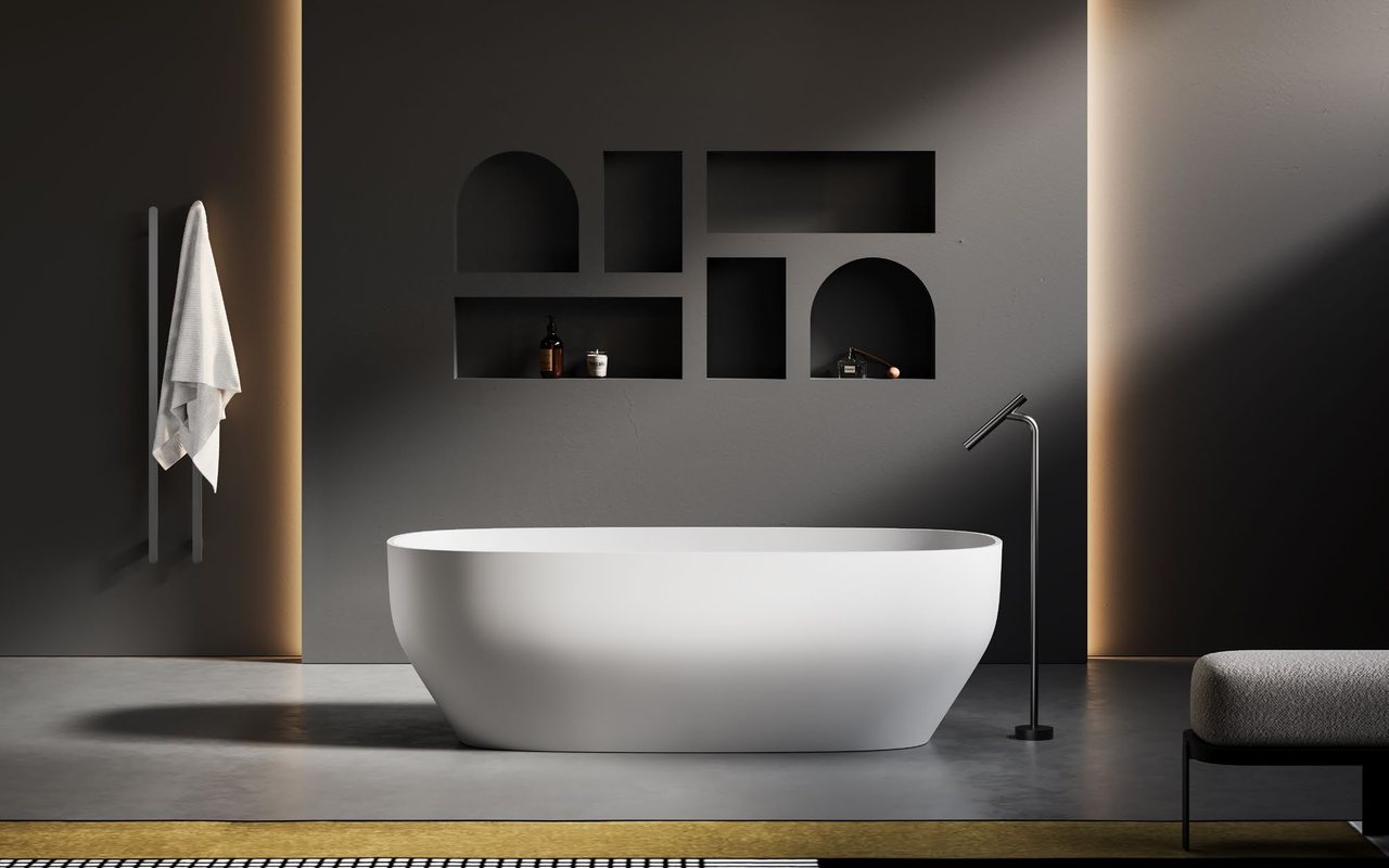 A flawless, smooth solid surface bathtub finish in a styled bathroom