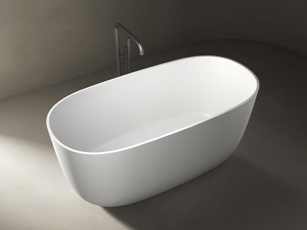 A compact freestanding soaking bathtub