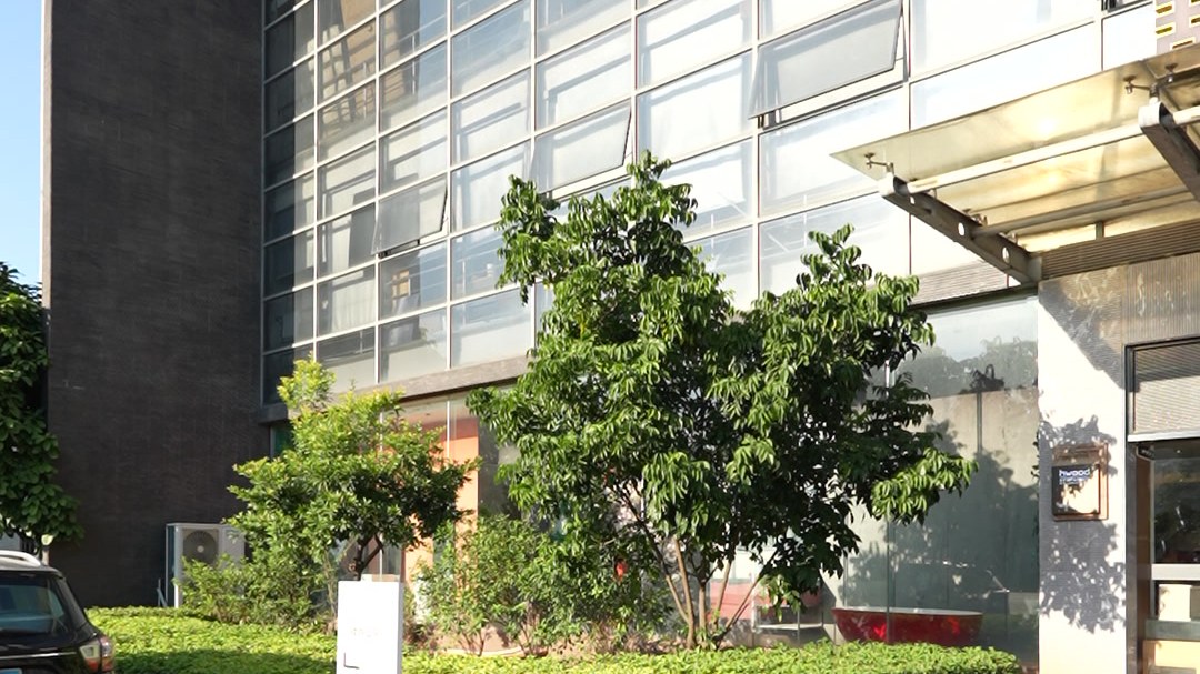 The glass-fronted exterior of the WNS production base