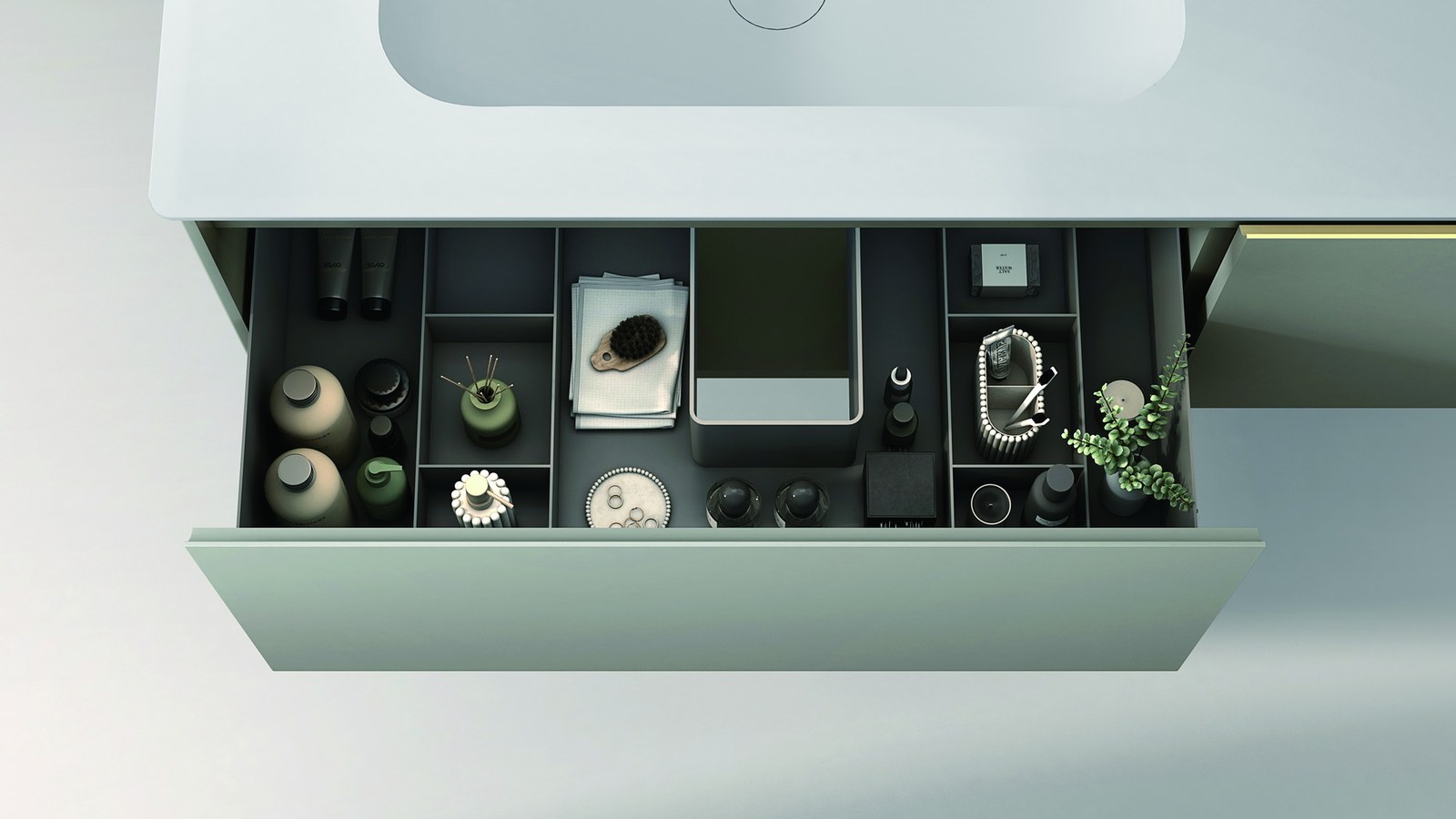 An open vanity drawer with divided compartments