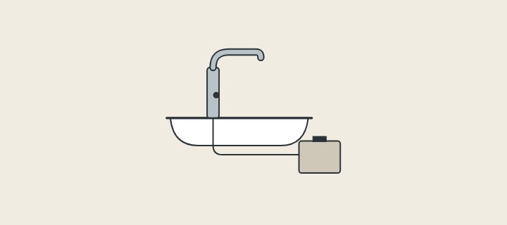 Illustration: a sensor faucet on a basin with a cable running to a control box below