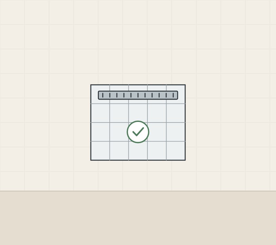 Illustration of a tiled floor seen from above with a linear grate along one edge and a tick