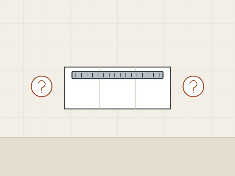 Illustration of a tiled floor with a linear drain seen from above between two question marks