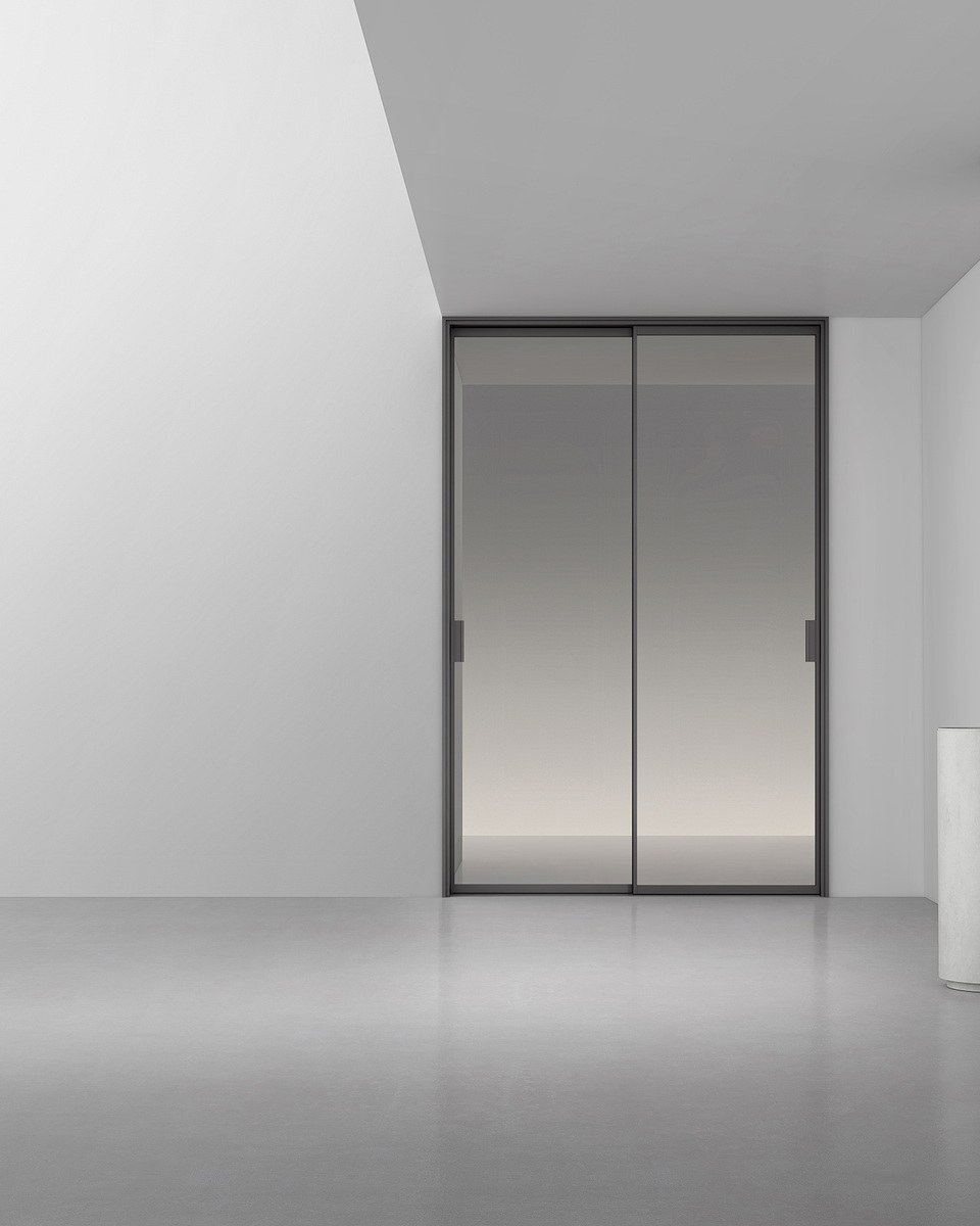 A walk-in shower area behind a glass screen