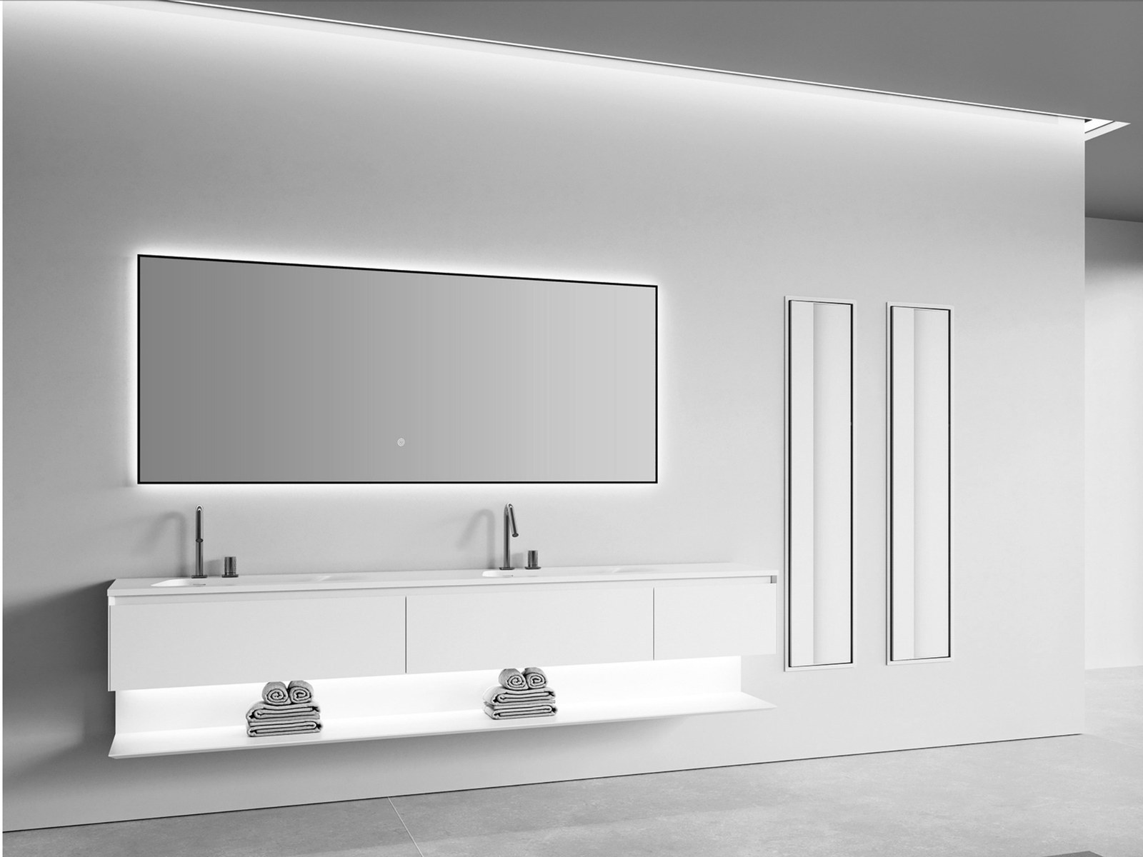 A long wall-hung vanity beneath a wide lit mirror