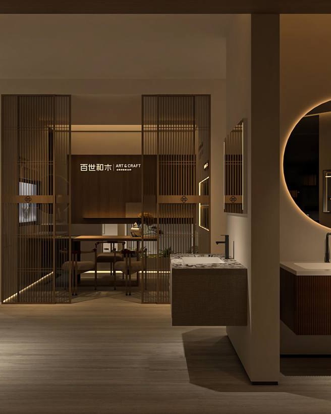 Showroom display of two wall-mounted bathroom vanities with lit round and rectangular mirrors