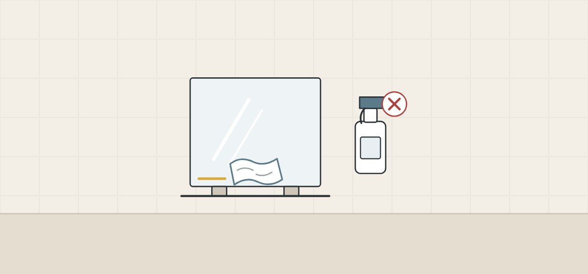 Illustration of a mirror on two spacer blocks with a cloth along its lower edge, beside a crossed-out spray bottle
