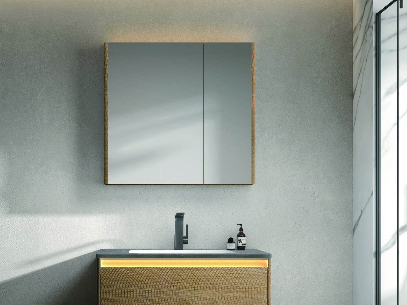 A mirror cabinet above a wall-hung vanity in a marble bathroom