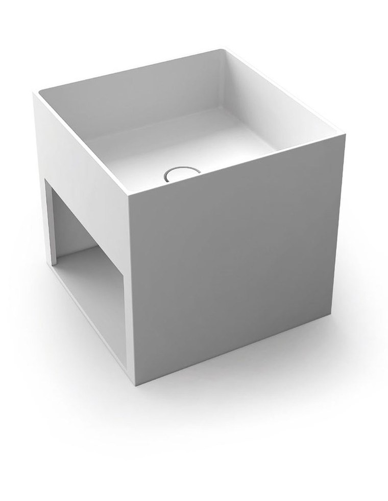 An integrated basin and vanity top formed as one piece