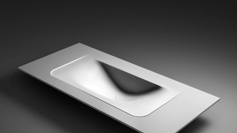 A rectangular integrated basin form shown against a dark background