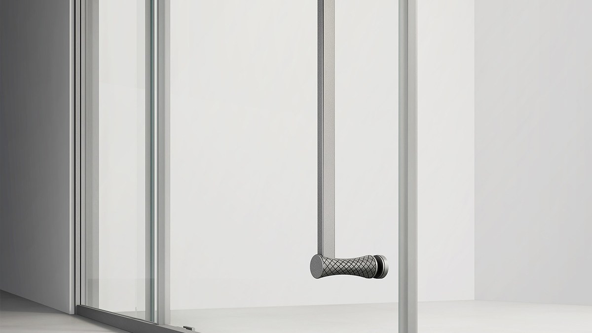 A polished glass edge on a frameless shower panel
