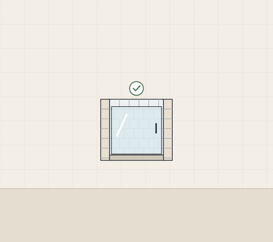 Illustration of a tiled shower opening with a glass panel fitted and a tick above