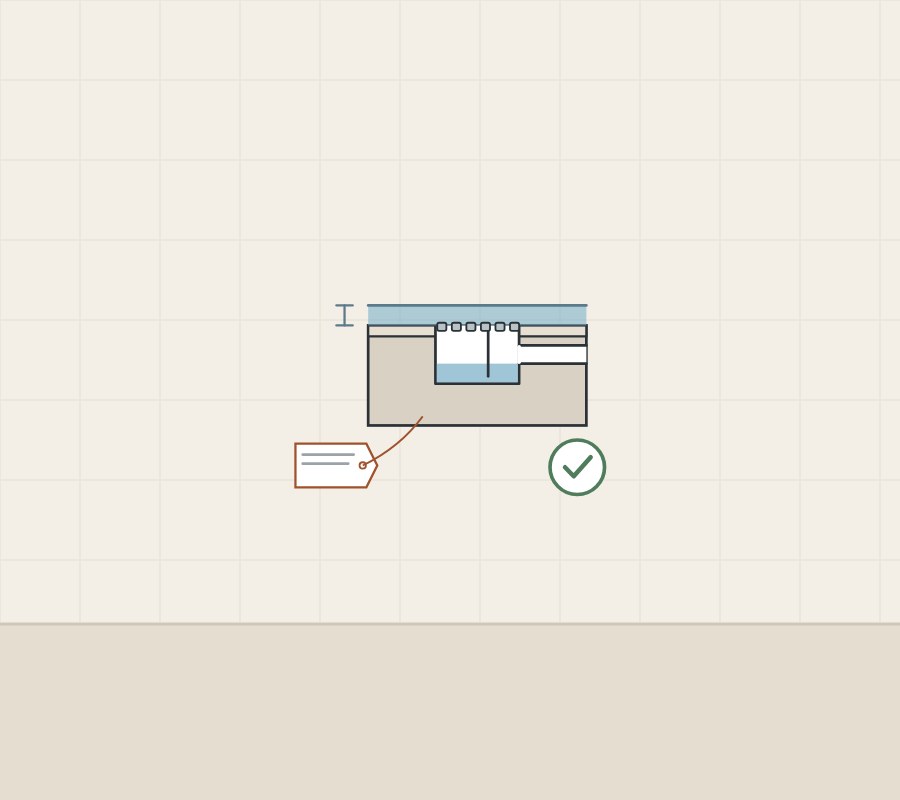 Illustration of a floor drain with a water-depth bracket, a rating tag tied to it and a tick