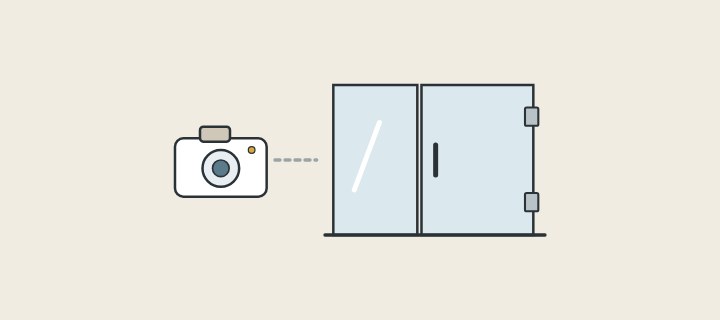 Illustration: a camera pointed at a two-panel glass shower enclosure