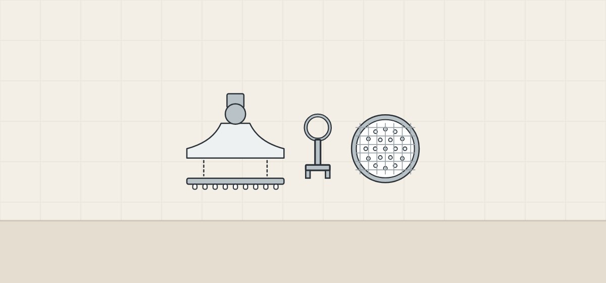 Illustration of a shower head with its spray plate removed, a plate key and a spray face behind a mesh cover