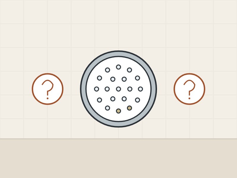 Illustration of a shower-head spray face between two question marks