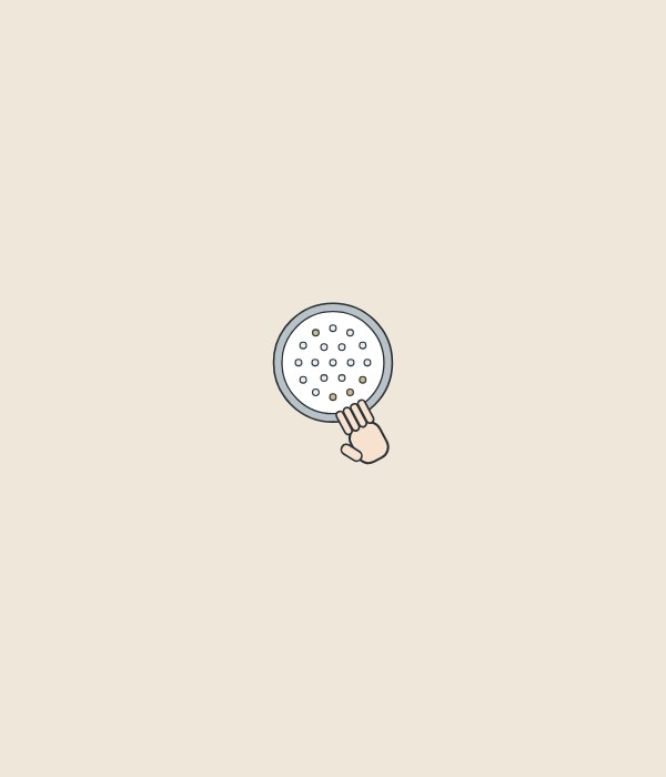 Illustration of a hand rubbing the nozzles on a round shower-head spray face