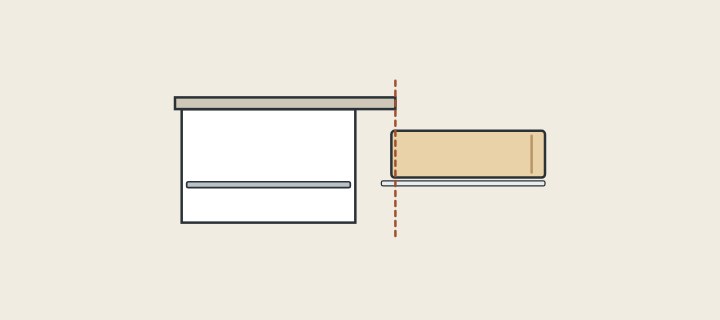 Illustration: a vanity in side section with its drawer pulled out beyond the edge of the overhanging top