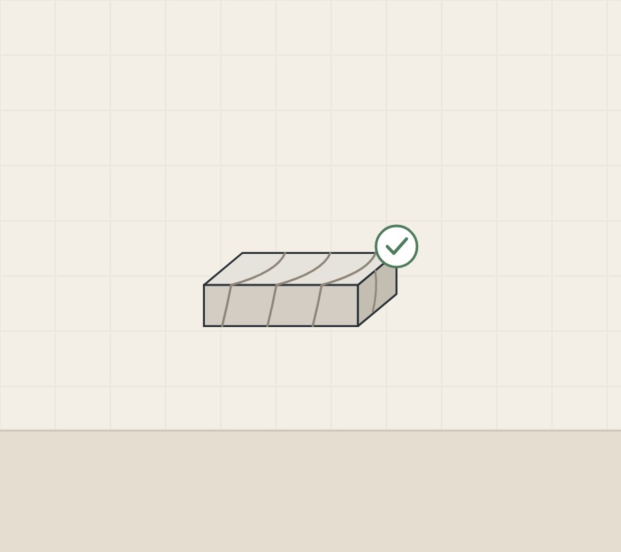 Illustration of a slab sample with veins continuing down its cut edge, with a tick