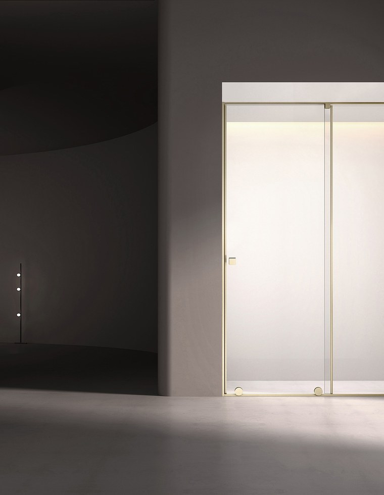 A sliding glass shower panel in a bright room